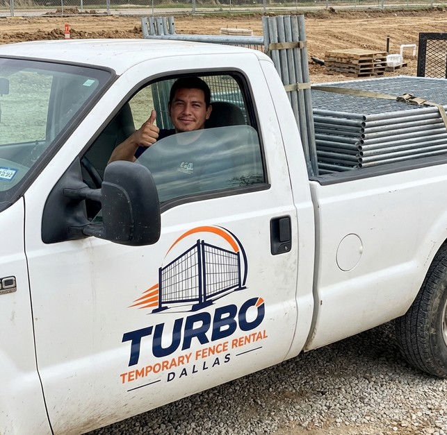 Turbo Temporary Fence Rental Dallas delivery truck loaded with temporary fence panels arriving at a job site